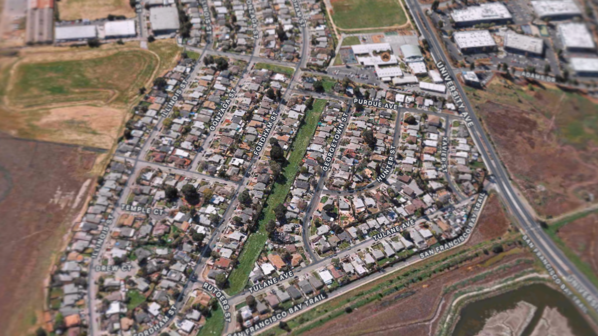 Notice the long green strip of SFPUC-owned land in the northern University Village neighborhood of East Palo Alto, CA. This photo is from Apple Maps 3D view, 